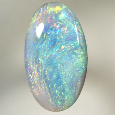 SOLID SEMI BLACK OPAL Bright sparkling colours moving over turquoise blue 